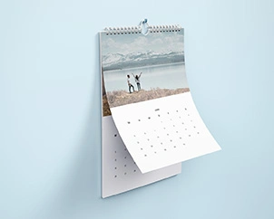 Portrait format wall calendar with example photo of people by the sea