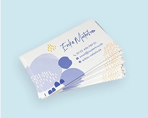 Stack of business cards with sample print in purple