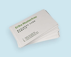 Stack of business cards with sample print in green