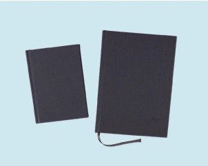 Two gray weekly planners in different formats next to each other